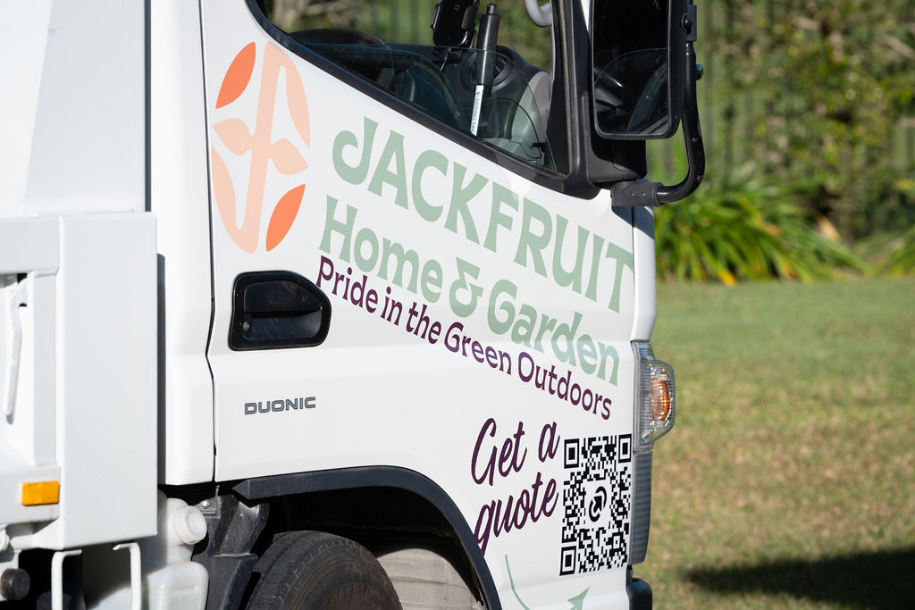 Branded Jackfruit Home and Garden work vehicle on a commercial site